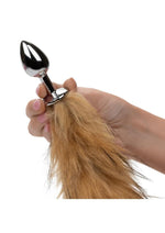 Cola de piel sintética y tapón anal metálico Running Wild